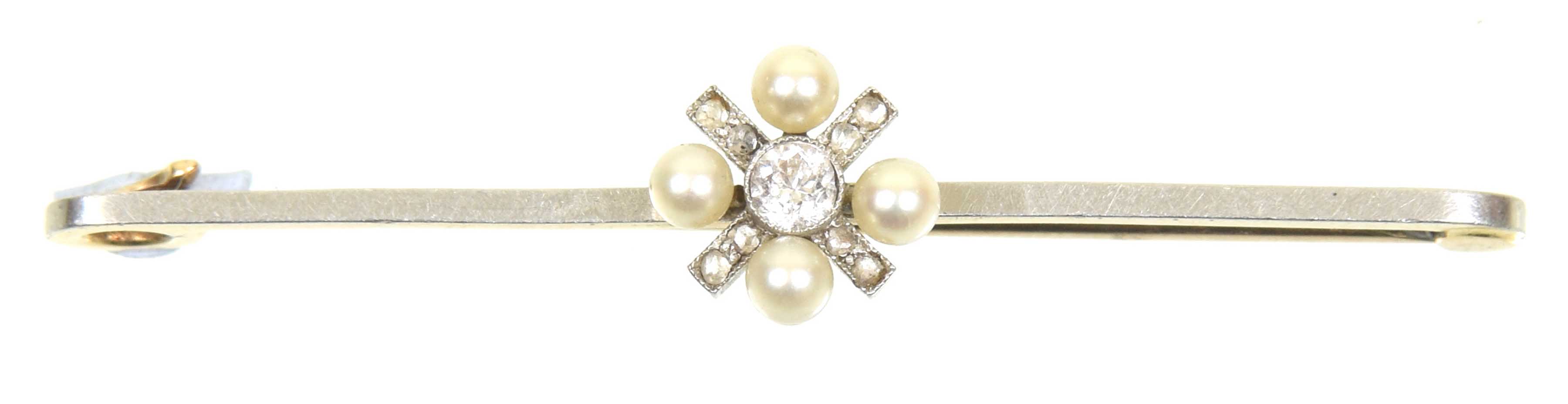 An early 20th Century diamond and seed pearl brooch The old cut diamond collet within a seed pearl