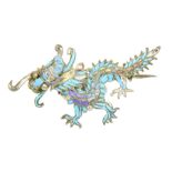A Chinese Kingfisher feather brooch In the form of a dragon, with vari-shade feather detailing,