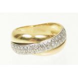 A diamond band ring The brilliant cut diamond band interwoven with two polished bands, estimated