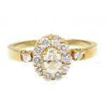A diamond cluster ring The oval shaped diamond within a brilliant cut diamond surround and
