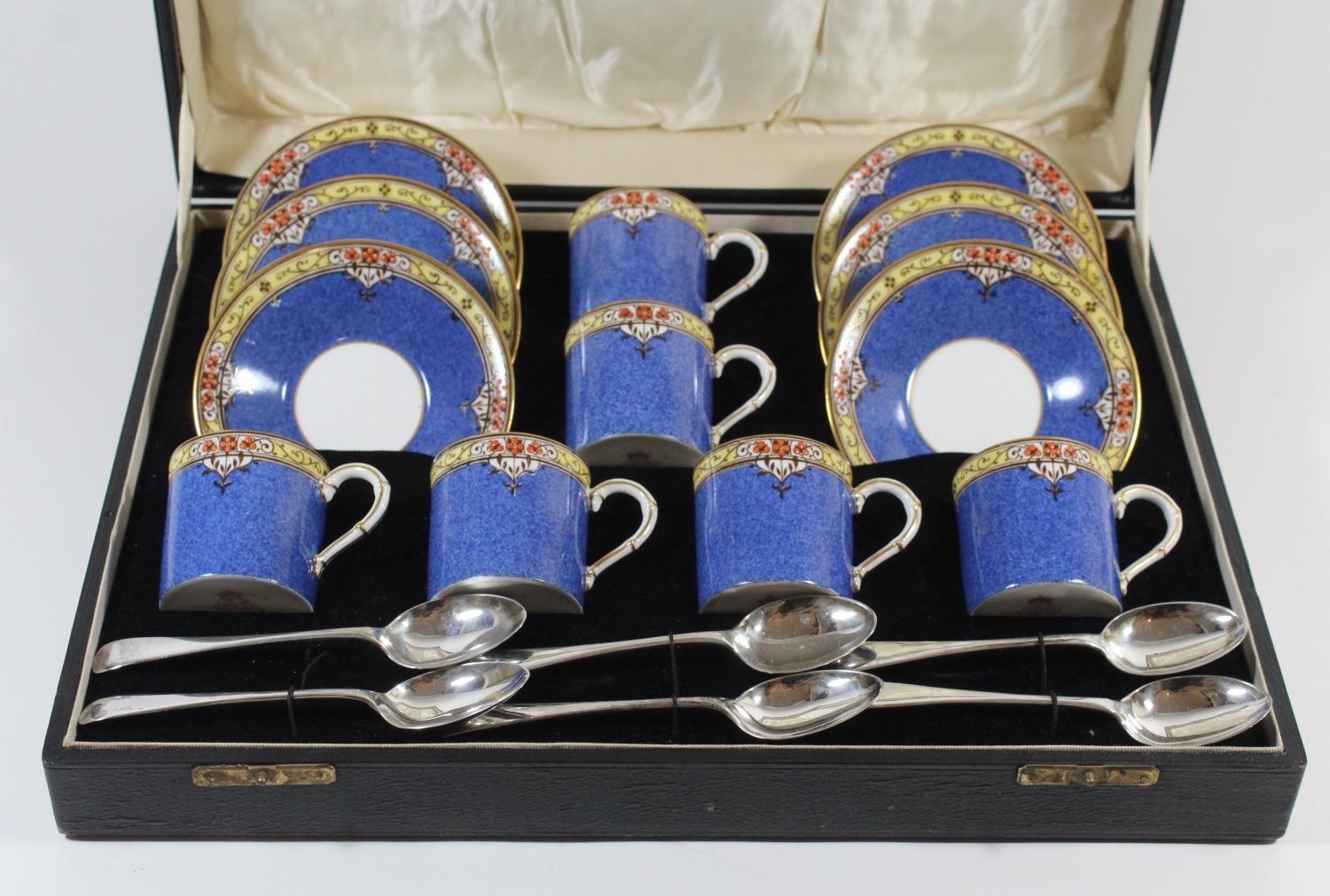 A cased set of six Royal Worcester coffee cans and saucers Pattern no. 994, together with six