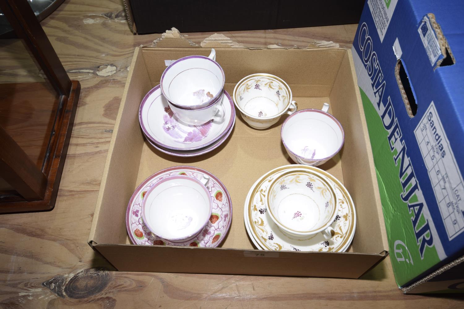 A collection of early 19th Century Staffordshire tea cups and saucers Including four pink lustre