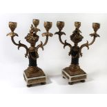 A pair Continental gilt metal and marble three branch candelabras The arms of foliate form with
