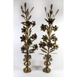 A pair of unusual late 19th/early 20th Century brass floral ornaments Raised on bases formed as