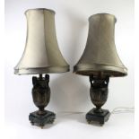 A pair of 20th Century table lamps Formed as metal Grecian style vases raised on stepped marble