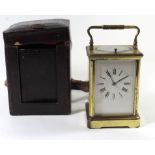 A late 19th/early 20th Century brass framed carriage clock With white enamel dial with Roman