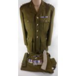 A British Army R.E.M.E. Captains uniform, late 20th Century Comprising jacket and trousers, tie,
