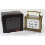 A late 19th/early 20th Century brass cased carriage clock With white enamel dial with Roman numerals