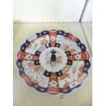 A late 19th/early 20th Century Japanese Imari charger with frilled rim