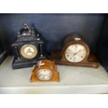 A mixed lot comprising a Victorian black slate mantel clock, an early 20th Century oak cased