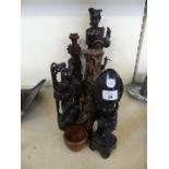 A mixed lot of various far eastern carved hardwood figures and other items