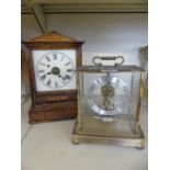 A 20th Century glazed electric mantel clock, together with a further early 20th Century oak cased