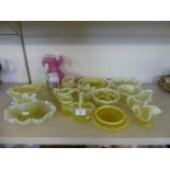 A collection of various moulded vaseline glass vases, jugs, bowls and other items, plus a further