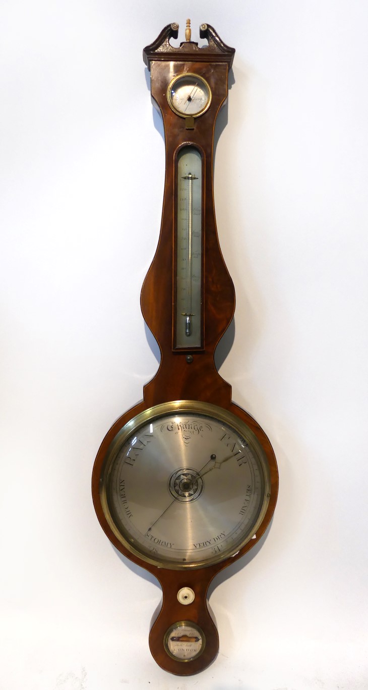 A 19th Century four glass barometer Fitted with damp dry gauge over thermometer, silvered circular