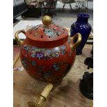 A 19th Century English transfer printed lidded jar The vibrant red bulbous form jar decorated with