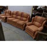 A Modern salmon pink and foliate pattern fabric three piece lounge suite.