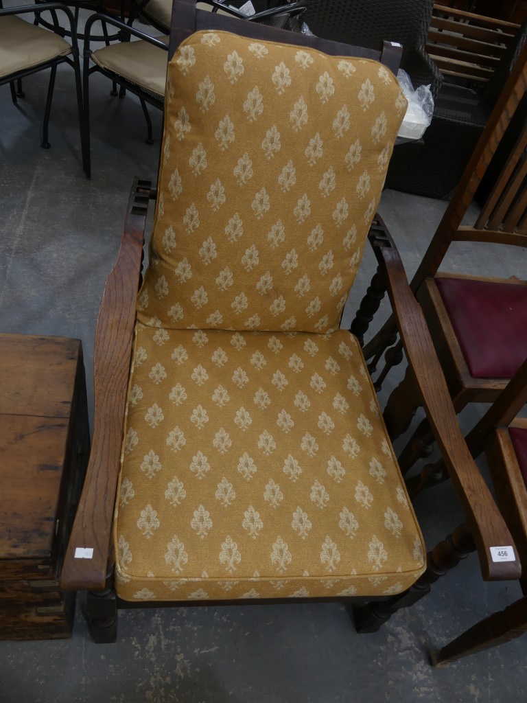 A 1930s oak reclining arm chair