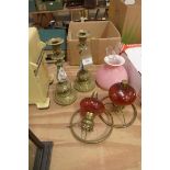 A pair of early 20th century gilt brass and porcelain bleu celeste candlesticks Along with two