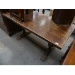 An early 20th Century oak slab top refectory table.