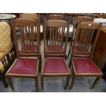A set of six early 20th Century Arts & Crafts oak dining chairs Each impressed with a registration