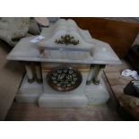 A Victorian alabaster architectural mantle clock with a gilt metal dial and two train movement.