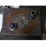 An early 20th century leather stationary folder applied with silver embellishments along with a