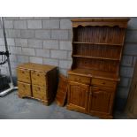 A modern pine kitchen dresser A pine four drawer chest and a pine hanging corner wall shelf. (3)