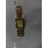 A gold plated Seiko wristwatch The rectangular shape gold tone dial with Roman numeral hour markers,