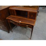 A Sheraton Revival serpentine mahogany and cross banded ladies writing desk, 19th Century Having a