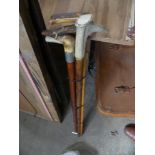 Five assorted horn handled walking sticks.