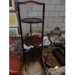 An Edwardian inlaid mahogany folding cake stand.