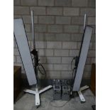 A pair of mid 20th Century Luminary Lighting Company studio lamps complete with pole uprights and