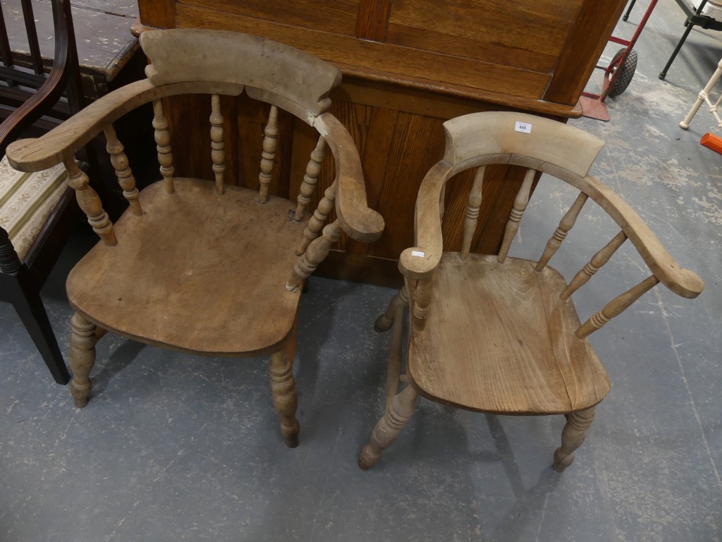 A pair of Victorian smokers bow elbow chairs