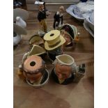 A collection of Royal Doulton figures and character jugs To include Tom Brown and Little Lord