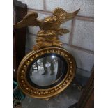 A Regency style gilt framed girandole convex wall mirror.