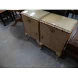 A Pair of limed walnut bedside cupboards.