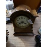 An Edwardian inlaid mahogany mantel clock With two train movement and white enamel dial.