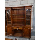 An 18th / 19th Century oak high back kitchen dresser Having a moulded inverted break front cornice
