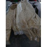 Three good quality inter lined beige pattern curtains, complete with two pelmets and ties.