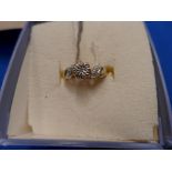 A 9ct gold diamond dress ring The single cut diamond with similarly cut diamond sides, hallmarks for