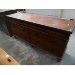 A Victorian mahogany dresser base With an arrangement of three frieze drawers over four drawers
