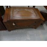A 20th Century Chinese carved camphor wood chest The stepped rectangular top carved in deep relief