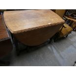 A 1930's Oak barley twist drop leaf table.