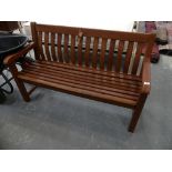 An Alexander Rose " Cornis " teak slatted garden bench.