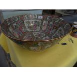 A large Chinese Cantonese bowl Painted with panels depicting dignitaries.