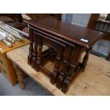 A Reproduction nest of 3 oak tables.