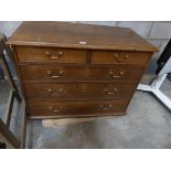 A Georgian oak chest of two short over three long drawers.