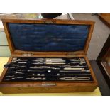 An early 20th century oak cased geometry set With removable fitted tray.