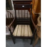 A Regency mahogany elbow chair with downswept arms