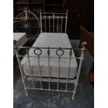 A painted Victorian iron and brass embellished single bed by Seventh Heaven to include mattress